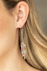 Threaded along dainty rods, an iridescent collection of topaz and white crystal-like beads cluster along a silver chain, creating a stellar tassel. Earring attaches to a standard fishhook fitting.
Sold as one pair of earrings. Threaded along dainty rods, an iridescent collection of topaz and white crystal-like beads cluster along a silver chain, creating a stellar tassel. Earring attaches to a standard fishhook fitting.
Sold as one pair of earrings.