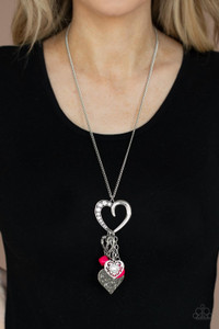 A flirtatiously mismatched collection of Raspberry Sorbet beads and ornate silver heart charms swing from the bottom of an oversized silver heart pendant at the bottom of a lengthened silver chain. Glassy white rhinestones are sprinkled through the collection, adding a sparkly finish to the romantic collaboration. Features an adjustable clasp closure.
Sold as one individual necklace. Includes one pair of matching earrings. A flirtatiously mismatched collection of Raspberry Sorbet beads and ornate silver heart charms swing from the bottom of an oversized silver heart pendant at the bottom of a lengthened silver chain. Glassy white rhinestones are sprinkled through the collection, adding a sparkly finish to the romantic collaboration. Features an adjustable clasp closure.
Sold as one individual necklace. Includes one pair of matching earrings.