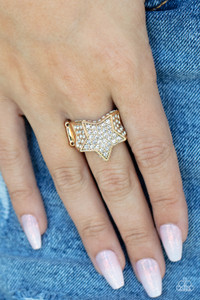 Encrusted in glittery white rhinestones, a sparkly gold star joins with a thick band of blinding white rhinestones. The edges of the star are embellished in additional white rhinestones, creating a stellar centerpiece atop the finger. Features a stretchy band for a flexible fit.
Sold as one individual ring. Encrusted in glittery white rhinestones, a sparkly gold star joins with a thick band of blinding white rhinestones. The edges of the star are embellished in additional white rhinestones, creating a stellar centerpiece atop the finger. Features a stretchy band for a flexible fit.
Sold as one individual ring.