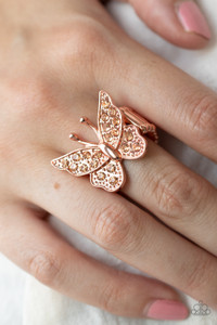 Encrusted in sparkly rhinestones, a shiny copper butterfly flutters atop the finger for an enchanting fashion. Features a stretchy band for a flexible fit.

Sold as one individual ring.