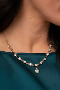 A white rhinestone heart charm dances from a strand of white rhinestones, resulting in a flirtatiously golden sparkle below the collar. Features an adjustable clasp closure.
Sold as one individual necklace. Includes one pair of matching earrings. A white rhinestone heart charm dances from a strand of white rhinestones, resulting in a flirtatiously golden sparkle below the collar. Features an adjustable clasp closure.
Sold as one individual necklace. Includes one pair of matching earrings.