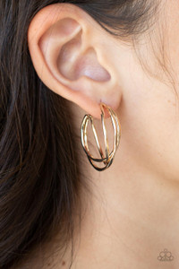 Glistening gold bars delicately overlap into a 3-dimensional frame, creating a dramatic hoop. Earring attaches to a standard post fitting. Hoop measures approximately 1" in diameter.
Sold as one pair of hoop earrings. Glistening gold bars delicately overlap into a 3-dimensional frame, creating a dramatic hoop. Earring attaches to a standard post fitting. Hoop measures approximately 1" in diameter.
Sold as one pair of hoop earrings.