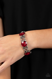 Featuring edgy chain-like fittings, a sparkly series of oversized red rhinestones are threaded along stretchy bands around the wrist for a dramatic pop of glitz.
Sold as one individual bracelet. Featuring edgy chain-like fittings, a sparkly series of oversized red rhinestones are threaded along stretchy bands around the wrist for a dramatic pop of glitz.
Sold as one individual bracelet.