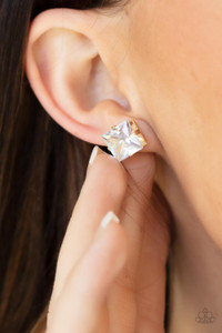 A stunning oversized square rhinestone, set in a classic gold pronged fitting, makes a show-stopping impact as it shines brilliantly and draws attention up to the face. Earring attaches to a standard post fitting.

Sold as one pair of post earrings.