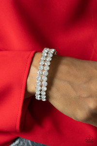 Encased in sleek silver fittings, two oversized rows of glassy white rhinestones stack into a blinding cuff around the wrist for a jaw-dropping look.
Sold as one individual bracelet. Encased in sleek silver fittings, two oversized rows of glassy white rhinestones stack into a blinding cuff around the wrist for a jaw-dropping look.
Sold as one individual bracelet.