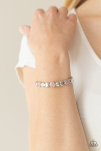 Glittery pink rhinestone encrusted frames and joined pairs of silver discs are threaded along stretchy bands around the wrist, creating a bubbly centerpiece.
Sold as one individual bracelet. Glittery pink rhinestone encrusted frames and joined pairs of silver discs are threaded along stretchy bands around the wrist, creating a bubbly centerpiece.
Sold as one individual bracelet.