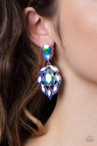 A stellar collection of marquise cut iridescent rhinestones nestle around an oversized teardrop iridescent rhinestone, creating a dramatically stellar display at the bottom of a matching oil spill teardrop rhinestone. Earring attaches to a standard post fitting.
Sold as one pair of post earrings. A stellar collection of marquise cut iridescent rhinestones nestle around an oversized teardrop iridescent rhinestone, creating a dramatically stellar display at the bottom of a matching oil spill teardrop rhinestone. Earring attaches to a standard post fitting.
Sold as one pair of post earrings.