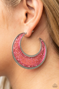 Flecked in silver shavings, a glistening pink acrylic half moon frame is bordered with flat shiny bars that coalesce into a curvaceous hoop. Earring attaches to a standard post fitting. Hoop measures approximately 2" in diameter.
Sold as one pair of hoop earrings. Flecked in silver shavings, a glistening pink acrylic half moon frame is bordered with flat shiny bars that coalesce into a curvaceous hoop. Earring attaches to a standard post fitting. Hoop measures approximately 2" in diameter.
Sold as one pair of hoop earrings.