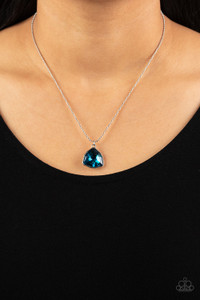A faceted asymmetrical blue gem is encased in a sleek silver frame at the bottom of a silver popcorn chain, creating a stellar pendant below the collar. Features an adjustable clasp closure.
Sold as one individual necklace. Includes one pair of matching earrings. A faceted asymmetrical blue gem is encased in a sleek silver frame at the bottom of a silver popcorn chain, creating a stellar pendant below the collar. Features an adjustable clasp closure.
Sold as one individual necklace. Includes one pair of matching earrings.