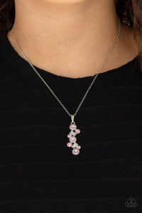Featuring classic round and regal emerald style cuts, a glittery collection of pink and white rhinestones delicately coalesce into a glamorous pendant below the collar. Features an adjustable clasp closure.
Sold as one individual necklace. Includes one pair of matching earrings. Featuring classic round and regal emerald style cuts, a glittery collection of pink and white rhinestones delicately coalesce into a glamorous pendant below the collar. Features an adjustable clasp closure.
Sold as one individual necklace. Includes one pair of matching earrings.