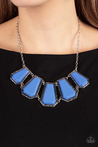 Encased in hammered silver fittings, trapezoidal blue acrylic frames delicately fan out below the collar for a dramatic pop of color. Features an adjustable clasp closure.
Sold as one individual necklace. Includes one pair of matching earrings. Encased in hammered silver fittings, trapezoidal blue acrylic frames delicately fan out below the collar for a dramatic pop of color. Features an adjustable clasp closure.
Sold as one individual necklace. Includes one pair of matching earrings.
