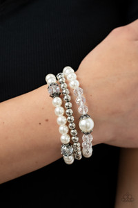 Stretchy pearl and silver beaded bracelets are adorned with ornate silver accents and glassy crystal-like beads, creating polished layers around the wrist.
Sold as one set of three bracelets. Stretchy pearl and silver beaded bracelets are adorned with ornate silver accents and glassy crystal-like beads, creating polished layers around the wrist.
Sold as one set of three bracelets.