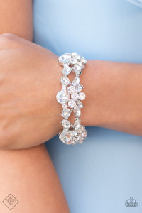 Crowned with an exquisite white rhinestone, stacks of round and marquise cut rhinestones coalesce into scintillating clusters. The glassy clusters are threaded along stretchy bands creating a dazzling display around the wrist.
Sold as one individual bracelet. Crowned with an exquisite white rhinestone, stacks of round and marquise cut rhinestones coalesce into scintillating clusters. The glassy clusters are threaded along stretchy bands creating a dazzling display around the wrist.
Sold as one individual bracelet.