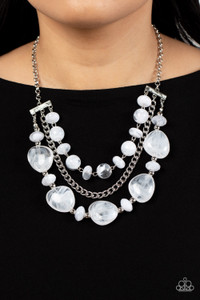 A single silver chain separates two mismatched rows of oversized and cloudy glass-like white beads. The colorful rows are held in place with textured silver fittings, creating an ethereal pop of color below the collar. Features an adjustable clasp closure.
Sold as one individual necklace. Includes one pair of matching earrings. A single silver chain separates two mismatched rows of oversized and cloudy glass-like white beads. The colorful rows are held in place with textured silver fittings, creating an ethereal pop of color below the collar. Features an adjustable clasp closure.
Sold as one individual necklace. Includes one pair of matching earrings.