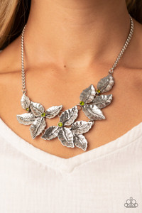 A textured collection of silver holly-like leaves are dotted with dainty green rhinestones as they bloom below the collar, invoking a festive spirit. Features an adjustable clasp closure.
Sold as one individual necklace. Includes one pair of matching earrings. A textured collection of silver holly-like leaves are dotted with dainty green rhinestones as they bloom below the collar, invoking a festive spirit. Features an adjustable clasp closure.
Sold as one individual necklace. Includes one pair of matching earrings.