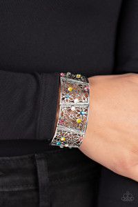Sporadically dotted with multicolored and iridescent rhinestones, an airy daisy pattern blooms inside trapezoidal silver frames that are threaded along stretchy bands around the wrist for a seasonal statement. Due to its prismatic palette, color may vary.
Sold as one individual bracelet. Sporadically dotted with multicolored and iridescent rhinestones, an airy daisy pattern blooms inside trapezoidal silver frames that are threaded along stretchy bands around the wrist for a seasonal statement. Due to its prismatic palette, color may vary.
Sold as one individual bracelet.