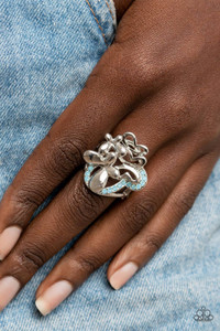 Enhanced with blue opal rhinestones, a shiny collection of mismatched silver butterfly frames flutters atop the finger, resulting in a whimsical bouquet. Features a stretchy band for a flexible fit.
Sold as one individual ring. Enhanced with blue opal rhinestones, a shiny collection of mismatched silver butterfly frames flutters atop the finger, resulting in a whimsical bouquet. Features a stretchy band for a flexible fit.
Sold as one individual ring.