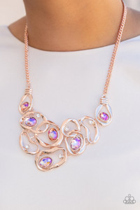 Warped rose gold frames asymmetrically curl around dainty white rhinestones and iridescent peach gem accents, interlocking into a contemporary statement piece below the collar. Features an adjustable clasp closure. Due to its prismatic palette, color may vary.
Sold as one individual necklace. Includes one pair of matching earrings. Warped rose gold frames asymmetrically curl around dainty white rhinestones and iridescent peach gem accents, interlocking into a contemporary statement piece below the collar. Features an adjustable clasp closure. Due to its prismatic palette, color may vary.
Sold as one individual necklace. Includes one pair of matching earrings.