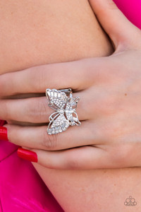 Sparkling with round, teardrop, and emerald cut white rhinestones, a silver butterfly fearlessly flutters atop the finger for a statement-making finish. Features a stretchy band for a flexible fit.
Sold as one individual ring. Sparkling with round, teardrop, and emerald cut white rhinestones, a silver butterfly fearlessly flutters atop the finger for a statement-making finish. Features a stretchy band for a flexible fit.
Sold as one individual ring.