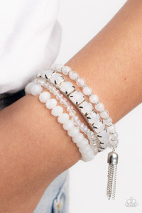 Pinched in silver fittings, a stretchy band of dewy white beads joins mismatched strands of cloudy and glassy white crystal-like and stretchy bracelets around the wrist. A single silver chain tassel dances from the crystalline compilation for a final flirty finesse.
Sold as one set of four bracelets. Pinched in silver fittings, a stretchy band of dewy white beads joins mismatched strands of cloudy and glassy white crystal-like and stretchy bracelets around the wrist. A single silver chain tassel dances from the crystalline compilation for a final flirty finesse.
Sold as one set of four bracelets.