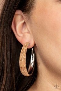 Silvery veins accent the front of a cork lined silver hoop, creating a refined display. Hoop measures approximately 2" in diameter. Earring attaches to a standard post fitting.
Sold as one pair of hoop earrings. Silvery veins accent the front of a cork lined silver hoop, creating a refined display. Hoop measures approximately 2" in diameter. Earring attaches to a standard post fitting.
Sold as one pair of hoop earrings.