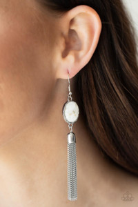 Flecks of shells are encased in a glassy silver bead that is encased in a hammered silver frame. A silver chain tassel swings from the bottom of the iridescent frame, creating an ethereal display. Earring attaches to a standard fishhook fitting.
Sold as one pair of earrings. Flecks of shells are encased in a glassy silver bead that is encased in a hammered silver frame. A silver chain tassel swings from the bottom of the iridescent frame, creating an ethereal display. Earring attaches to a standard fishhook fitting.
Sold as one pair of earrings.