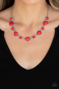 Encased in sleek silver frames, a fiery collection of round and teardrop red stones delicately link below the collar for a whimsical pop of color. Features an adjustable clasp closure.
Sold as one individual necklace. Includes one pair of matching earrings. Encased in sleek silver frames, a fiery collection of round and teardrop red stones delicately link below the collar for a whimsical pop of color. Features an adjustable clasp closure.
Sold as one individual necklace. Includes one pair of matching earrings.