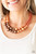 Infused with dainty silver accents, classic orange and brown pearls layer below the collar in a timeless fashion. Features an adjustable clasp closure.

Sold as one individual necklace. Includes one pair of matching earrings.