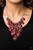 Tinted in the classic rich hue of Wine, polished red teardrops gradually increase in size as they trickle along rows of interconnected mesh chain. The robust beads drip into a tapered shape, creating a dramatic fringe below the collar. Features an adjustable clasp closure.

Sold as one individual necklace. Includes one pair of matching earrings.