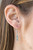 Flat silver teardrops and blue crystal-like teardrops swing from the bottom of a shimmery silver chain below the collar. A matching tassel swings from the center, creating a whimsical extended pendant. Features an adjustable clasp closure.
Sold as one individual necklace. Includes one pair of matching earrings. Flat silver teardrops and blue crystal-like teardrops swing from the bottom of a shimmery silver chain below the collar. A matching tassel swings from the center, creating a whimsical extended pendant. Features an adjustable clasp closure.
Sold as one individual necklace. Includes one pair of matching earrings.