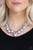 Capped in glistening gunmetal fittings, oversized silver  beads and a collection of classic silver or pink beads swing from the bottom of a shimmery silver chain, creating a bubbly fringe below the collar. Features an adjustable clasp closure. Capped in glistening gunmetal fittings, oversized silver  beads and a collection of classic silver or pink beads swing from the bottom of a shimmery silver chain, creating a bubbly fringe below the collar. Features an adjustable clasp closure.