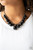 Capped in glistening gunmetal fittings, oversized black beads and a collection of classic black beads swing from the bottom of a shimmery gunmetal chain, creating a bubbly fringe below the collar. Features an adjustable clasp closure. Capped in glistening gunmetal fittings, oversized black beads and a collection of classic black beads swing from the bottom of a shimmery gunmetal chain, creating a bubbly fringe below the collar. Features an adjustable clasp closure.