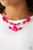 Infused with dainty metallic accents, a collection of faceted pink and sparkling crystal-like beads are threaded along invisible wires below the collar for a whimsically layered look. Features an adjustable clasp closure. Infused with dainty metallic accents, a collection of faceted pink and sparkling crystal-like beads are threaded along invisible wires below the collar for a whimsically layered look. Features an adjustable clasp closure.