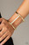 Glassy white rhinestones are encrusted down the spine of an airy gold or silver cuff for an edgy look.
Sold as one individual bracelet. Glassy white rhinestones are encrusted down the spine of an airy gold or silver cuff for an edgy look.
Sold as one individual bracelet.