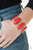 Dotted with oblong red beaded centers, vibrant silver frames link around the wrist for a powerful pop of color. Features an adjustable clasp closure.

Sold as one individual bracelet.