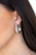 The front half of a thick silver hoop is encrusted in dazzling white rhinestones for a flawless look. Earring attaches to a standard post fitting. Hoop measures 1" in diameter.

Sold as one pair of hoop earrings.