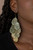 Embossed in a tropical floral pattern, antiqued brass teardrops cascade from the ear, coalescing into a noise-making lure. Earring attaches to a standard fishhook fitting.

Sold as one pair of earrings.