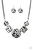 Featuring textured white and gray cheetah print, a wild collection of circle and square leather pieces are threaded along an invisible wire below the collar for a fierce look. Features an adjustable clasp closure.

Sold as one individual necklace. Includes one pair of matching earrings.