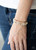 Rhinestone encrusted gold bars flank a dazzling trio of oversized white rhinestones, coalescing into a glittery frame. The sparkly frames are threaded along stretchy bands around the wrist, creating an irresistible shimmer.
Sold as one individual bracelet. Rhinestone encrusted gold bars flank a dazzling trio of oversized white rhinestones, coalescing into a glittery frame. The sparkly frames are threaded along stretchy bands around the wrist, creating an irresistible shimmer.
Sold as one individual bracelet.