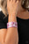 Featuring a pink, white, and purple tortoise shell-like pattern, a thick acrylic cuff delicately curls around the wrist for a colorfully chic look.

Sold as one individual bracelet.