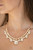 A glamorous collection of bubbly white pearls and exaggerated white teardrop gems dangle from a bold strand of white rhinestones, creating a knockout fringe below the collar. Features an adjustable clasp closure.
Sold as one individual necklace. Includes one pair of matching earrings. A glamorous collection of bubbly white pearls and exaggerated white teardrop gems dangle from a bold strand of white rhinestones, creating a knockout fringe below the collar. Features an adjustable clasp closure.
Sold as one individual necklace. Includes one pair of matching earrings.