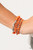 Infused with dainty silver beads, a mismatched collection of refreshing orange and shiny silver beads are threaded along stretchy bands around the wrist for a colorfully layered look.

Sold as one set of five bracelets.
