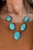 Bordered in rustic silver studded frames, an earthy collection of oversized turquoise stones boldly links below the collar, creating a timeless Southwestern staple. Features an adjustable clasp closure.

Sold as one individual necklace. Includes one pair of matching earrings.