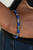 An earthy collection of faceted gunmetal beads and glassy blue stone beads are threaded along a stretchy band around the wrist for a bold seasonal look.

Sold as one individual bracelet.