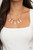 Infused with cylindrical shiny copper accents, a glittery collection of oversized glassy white teardrop gems slide along a dainty shiny copper chain below the collar for a jaw-dropping finish. Features an adjustable clasp closure.
Sold as one individual necklace. Includes one pair of matching earrings. Infused with cylindrical shiny copper accents, a glittery collection of oversized glassy white teardrop gems slide along a dainty shiny copper chain below the collar for a jaw-dropping finish. Features an adjustable clasp closure.
Sold as one individual necklace. Includes one pair of matching earrings.