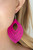 Stenciled in an airy cutout pattern, a teardrop pink wooden frame swings from the ear for a seasonal look. Earring attaches to a standard fishhook fitting.

Sold as one pair of earrings.