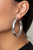 A thick silver bar dramatically curls into an oversized hoop for a classic look. Earring attaches to a standard post fitting. Hoop measures approximately 2 1/2" in diameter.

Sold as one pair of hoop earrings.