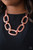 Delicately hammered in blinding shimmer, oversized shiny copper chain links and textured fittings connect below the collar. Suspended from strands of shiny copper chains, the bold links catch and reflect the light for a statement-making finish. Features an adjustable clasp closure.
Sold as one individual necklace. Includes one pair of matching earrings. Delicately hammered in blinding shimmer, oversized shiny copper chain links and textured fittings connect below the collar. Suspended from strands of shiny copper chains, the bold links catch and reflect the light for a statement-making finish. Features an adjustable clasp closure.
Sold as one individual necklace. Includes one pair of matching earrings.