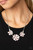 Dotted with glassy white rhinestone centers, a trio of pink cat's eye stone petaled flowers blossom below the collar for an enchanted look. Features an adjustable clasp closure.
Sold as one individual necklace. Includes one pair of matching earrings. Dotted with glassy white rhinestone centers, a trio of pink cat's eye stone petaled flowers blossom below the collar for an enchanted look. Features an adjustable clasp closure.
Sold as one individual necklace. Includes one pair of matching earrings.