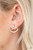 A solitaire emerald-cut rhinestone attaches to a double-sided post, designed to fasten behind the ear. Radiating with a bowing row of white rhinestones, the double sided-post peeks out beneath the ear for an edgy look. Earring attaches to a standard post fitting.
Sold as one pair of double-sided post earrings. A solitaire emerald-cut rhinestone attaches to a double-sided post, designed to fasten behind the ear. Radiating with a bowing row of white rhinestones, the double sided-post peeks out beneath the ear for an edgy look. Earring attaches to a standard post fitting.
Sold as one pair of double-sided post earrings.